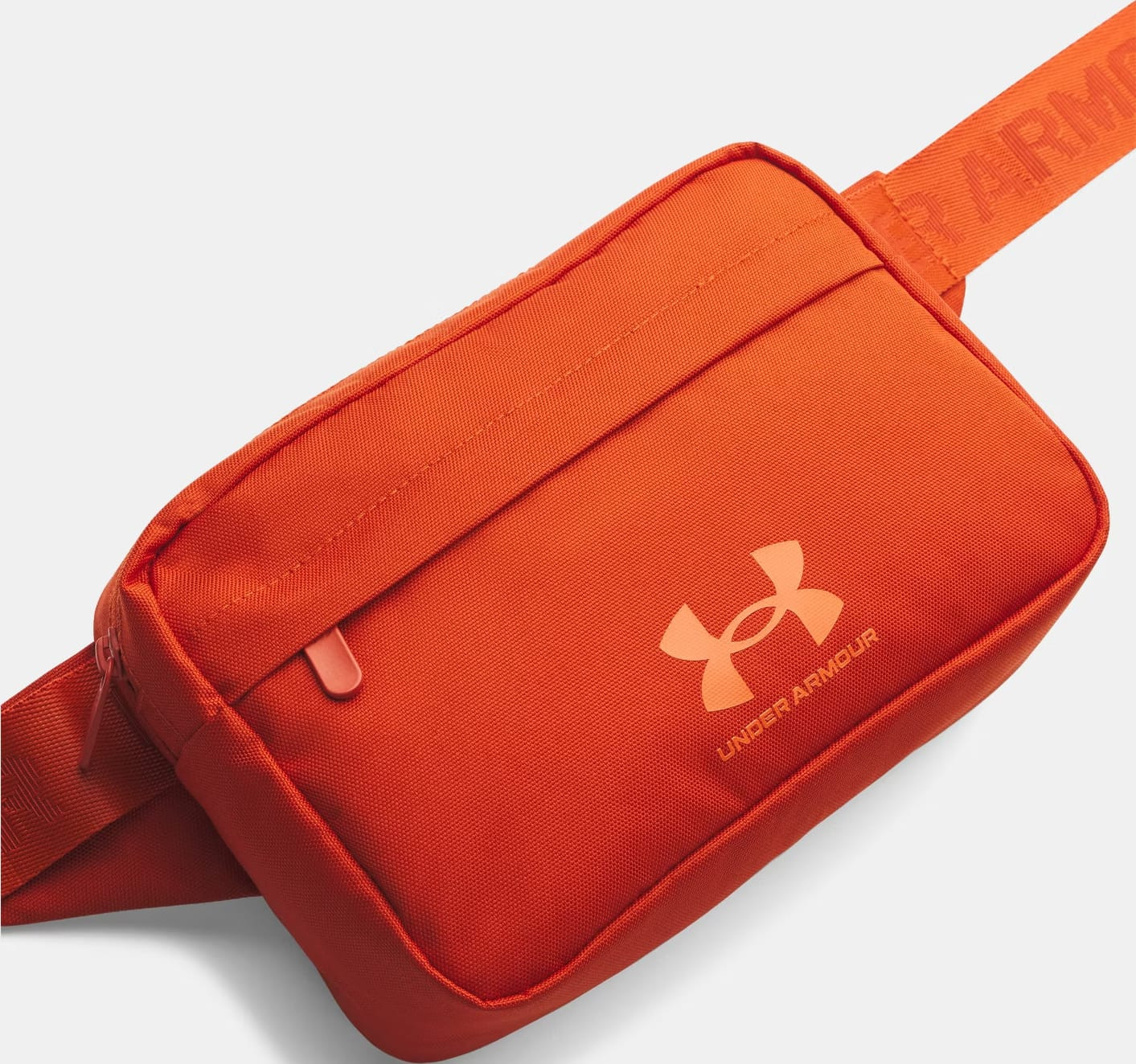 Сумка на пояс Under Armour Essential Lite WB Xbody 2L помаранчевий 15,3 x 24 x 10,5 см (1381914-842) 1381914-842