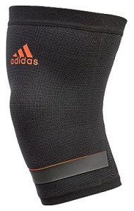 Фіксатор коліна Adidas Performance Knee Support чорний, червоний Уні M ADSU-13322RD