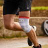 Фіксатор коліна Reebok Speedwick Knee Support білий, червоний Уні S RRSU-14323