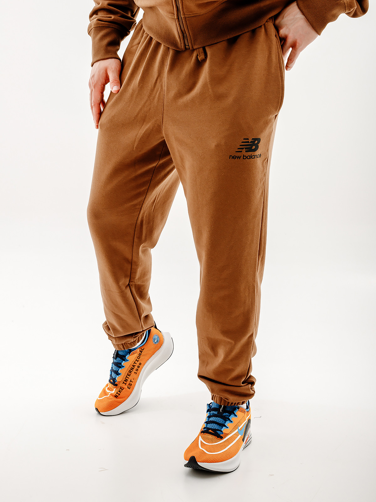 Штани New Balance Essentials Stacked Logo MP31539DHE