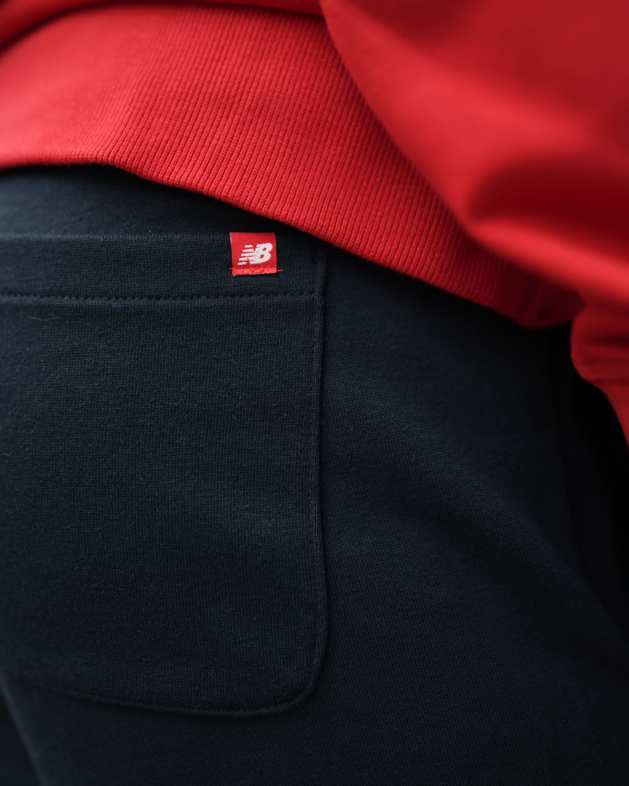 Брюки New Balance NB Ess Stacked Logo MP03558ECL