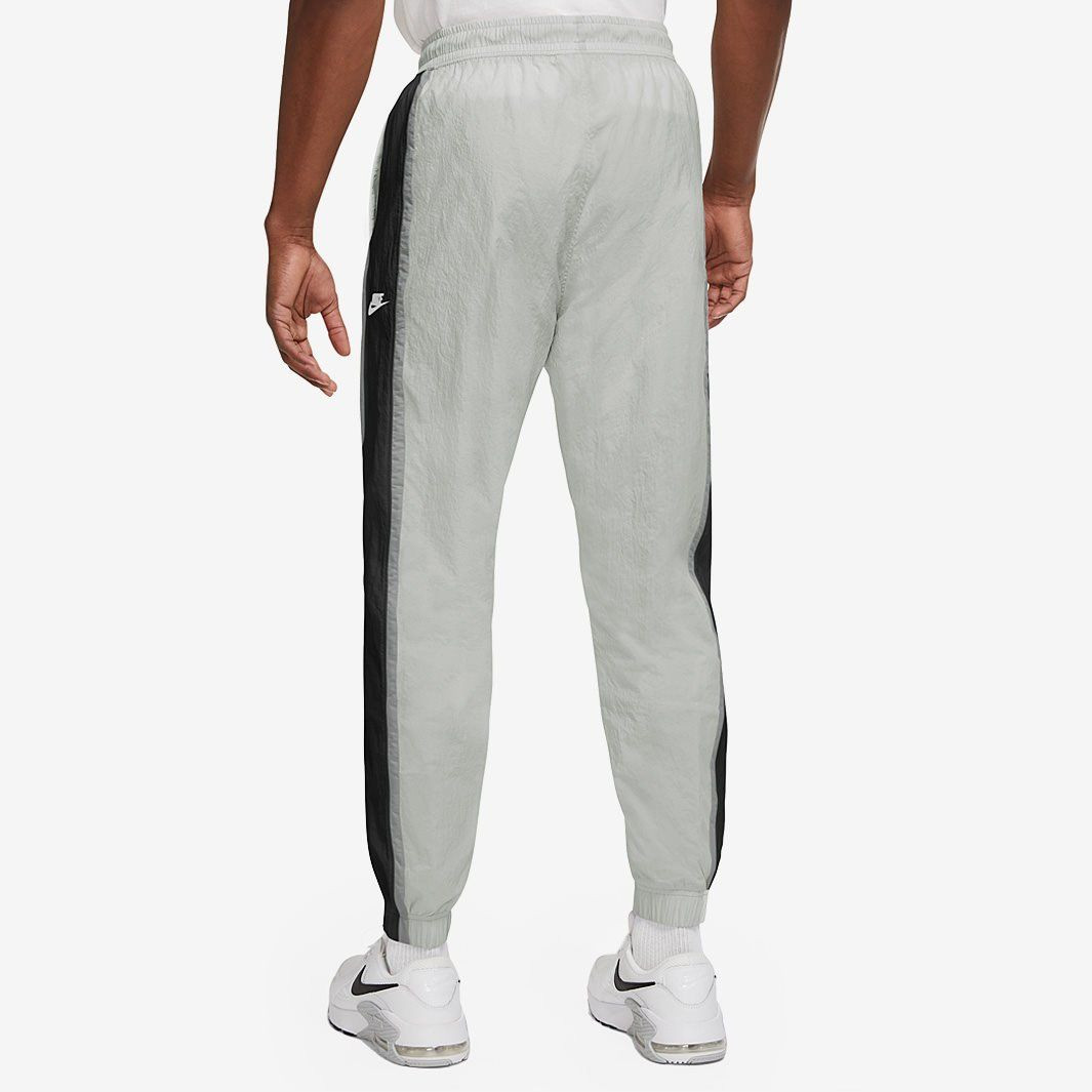 Брюки Nike M NSW WVN LINED PANT SNL CB CZ9964-097